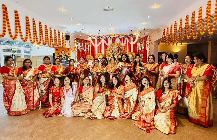 The Sanatani Essex UK family in red and white