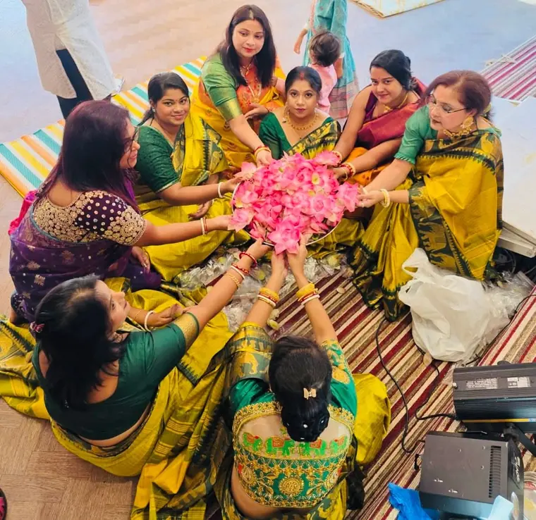 Preparing flowers for the puja
